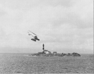 In this pre-1970 image the blacksmith shop appears as a long low building at the base of the tower