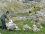 April 26, 2006, Darcy Mathews records the details of the boulder configuration of one cairn. Precise measurements of distances and boulder size and composition are taken.