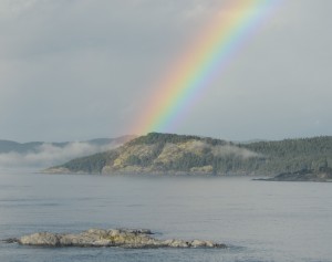 A rainbow appeared as the fog was burning off this morning. Turbine Rock is in the foreground. The pot of gold is Church Point.