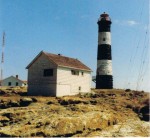 n this picture, taken before 1976, the radio tower for communications, (VHF?) appears on the left hand side. On the right side are the guy-wires for the radio beacon.